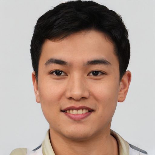 Joyful asian young-adult male with short  black hair and brown eyes