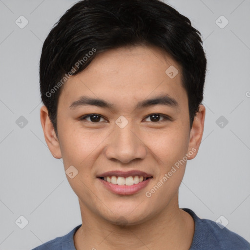 Joyful asian young-adult male with short  black hair and brown eyes