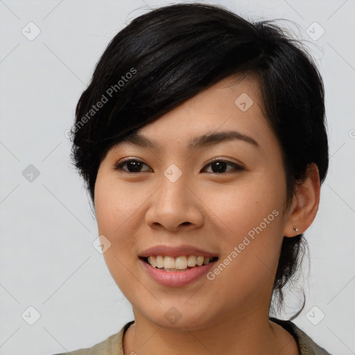 Joyful asian young-adult female with medium  black hair and brown eyes