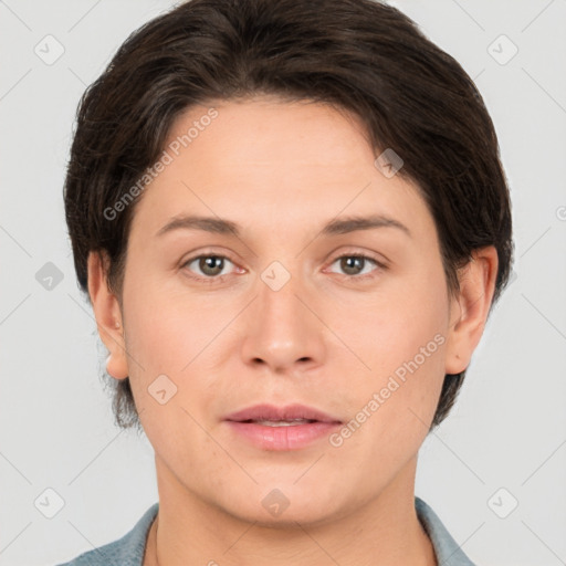 Joyful white adult female with short  brown hair and brown eyes