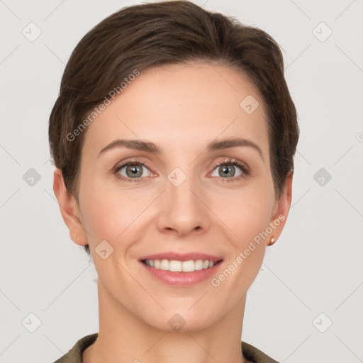 Joyful white young-adult female with short  brown hair and grey eyes