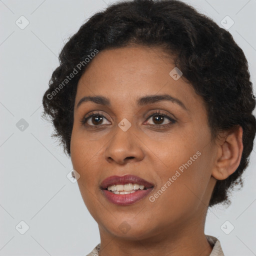 Joyful black young-adult female with short  brown hair and brown eyes