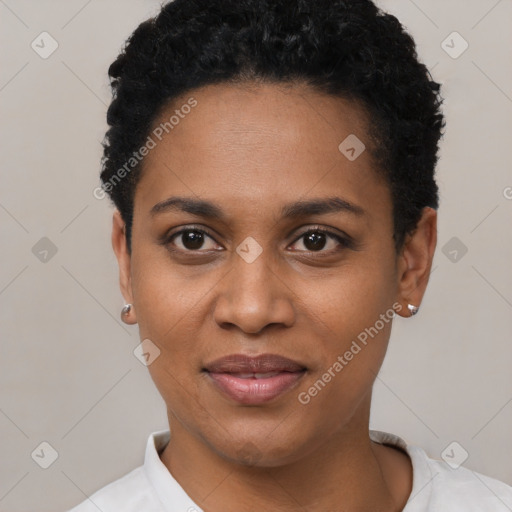 Joyful black young-adult female with short  black hair and brown eyes