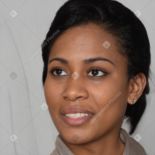 Joyful black young-adult female with medium  black hair and brown eyes