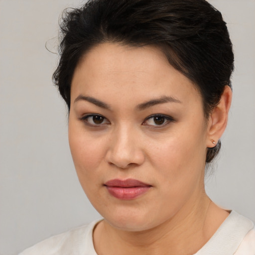 Joyful white young-adult female with medium  brown hair and brown eyes