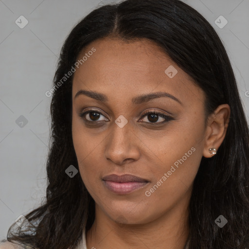 Joyful black young-adult female with long  brown hair and brown eyes