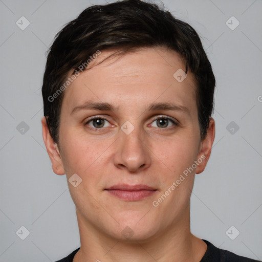 Joyful white adult female with short  brown hair and grey eyes