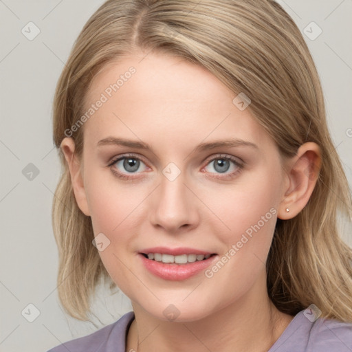 Joyful white young-adult female with medium  brown hair and blue eyes