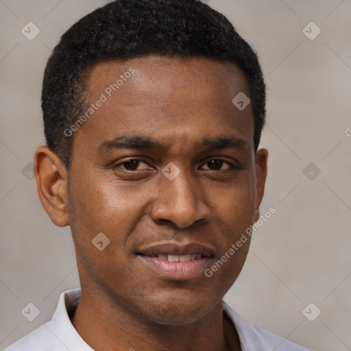 Joyful black young-adult male with short  brown hair and brown eyes