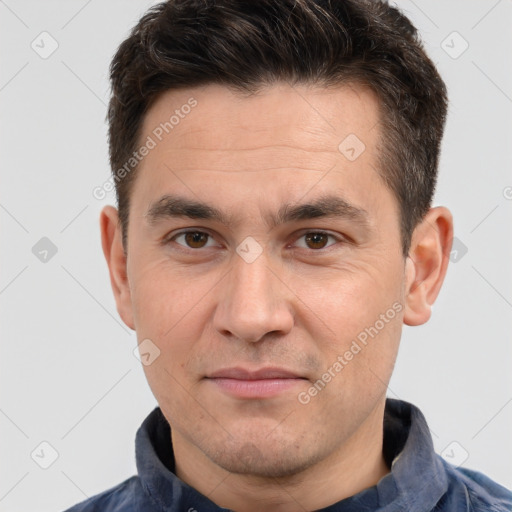 Joyful white adult male with short  brown hair and brown eyes