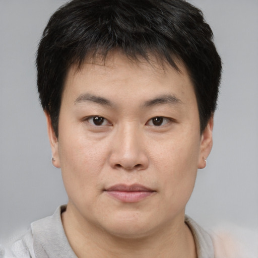 Neutral asian young-adult male with short  brown hair and brown eyes