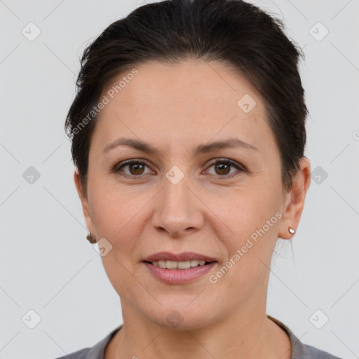 Joyful white adult female with short  brown hair and brown eyes