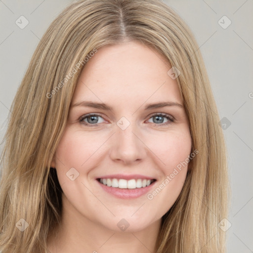 Joyful white young-adult female with long  brown hair and grey eyes