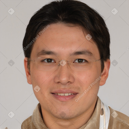 Joyful asian adult male with short  brown hair and brown eyes