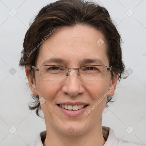 Joyful white adult female with short  brown hair and grey eyes