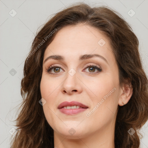 Joyful white young-adult female with long  brown hair and green eyes