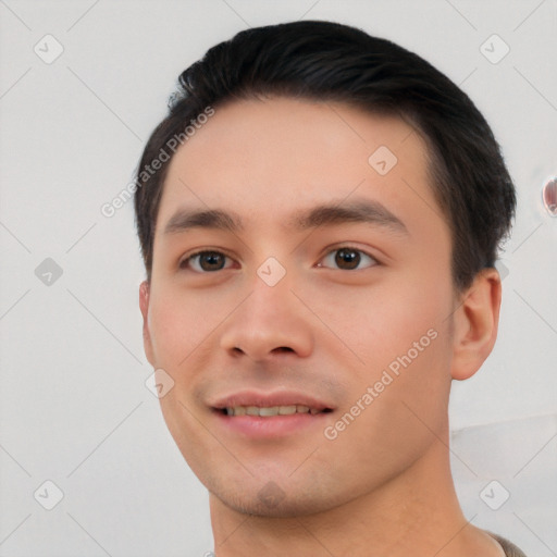 Joyful white young-adult male with short  black hair and brown eyes