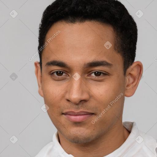 Joyful latino young-adult male with short  black hair and brown eyes