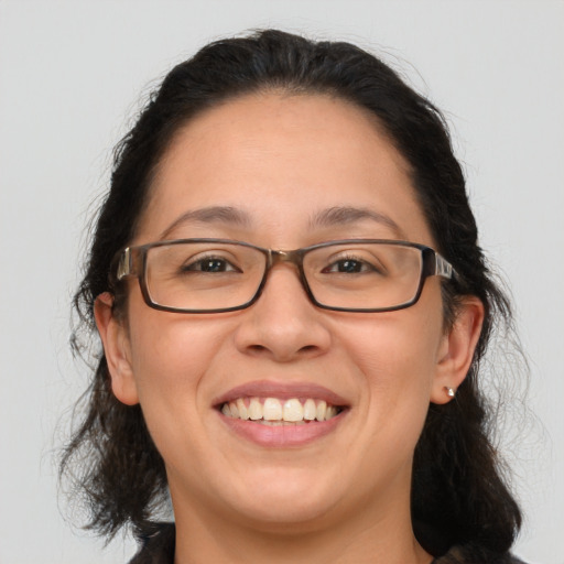 Joyful white adult female with medium  brown hair and brown eyes