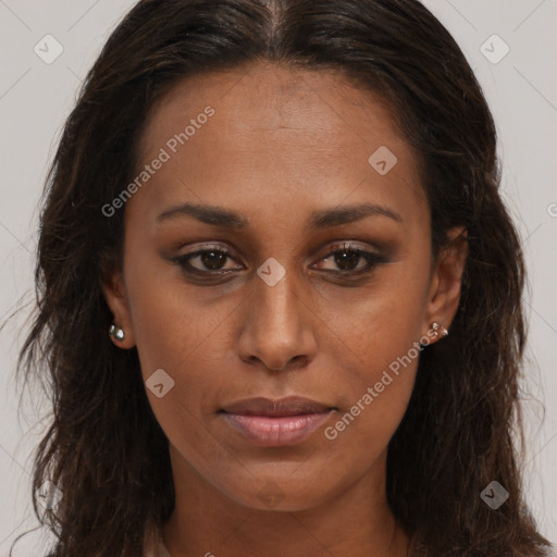 Joyful black young-adult female with long  brown hair and brown eyes