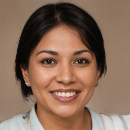 Joyful white young-adult female with medium  brown hair and brown eyes