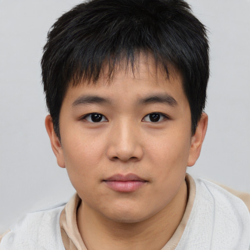 Neutral asian child male with short  brown hair and brown eyes