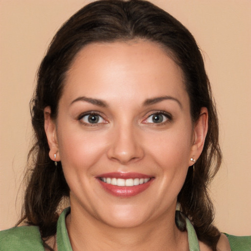 Joyful white young-adult female with medium  brown hair and brown eyes