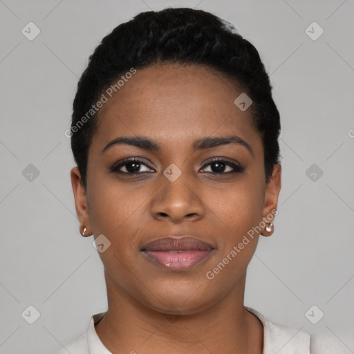 Joyful black young-adult female with short  black hair and brown eyes