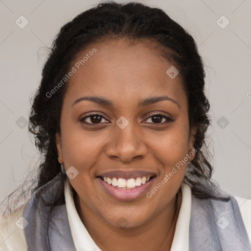 Joyful black young-adult female with long  brown hair and brown eyes