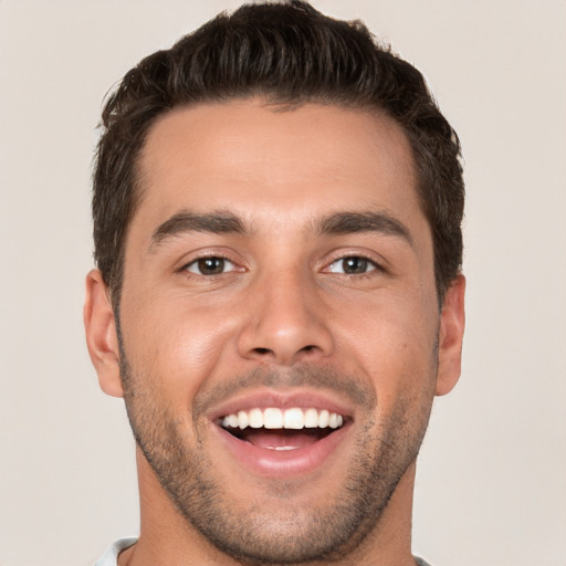 Joyful white young-adult male with short  brown hair and brown eyes