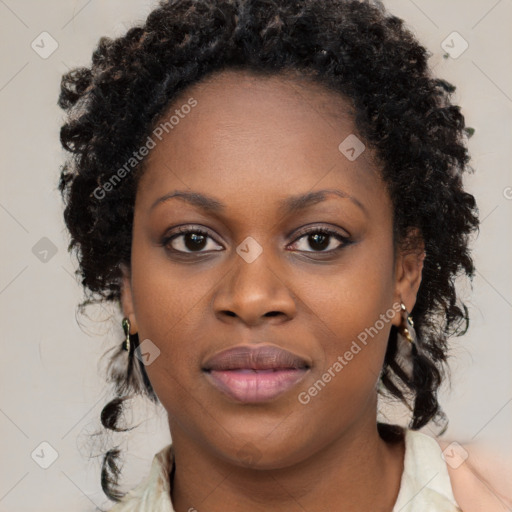 Joyful black young-adult female with long  brown hair and brown eyes