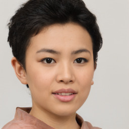 Joyful asian young-adult female with short  black hair and brown eyes