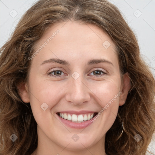 Joyful white young-adult female with long  brown hair and green eyes