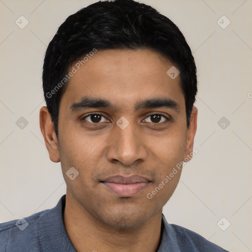 Joyful latino young-adult male with short  black hair and brown eyes