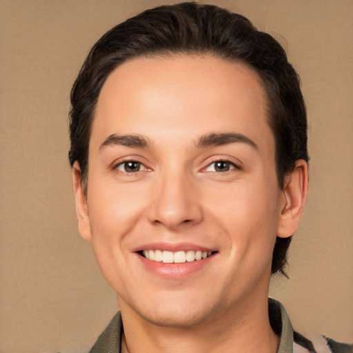 Joyful white young-adult male with short  brown hair and brown eyes