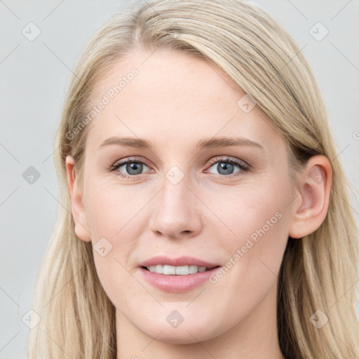 Joyful white young-adult female with long  brown hair and blue eyes