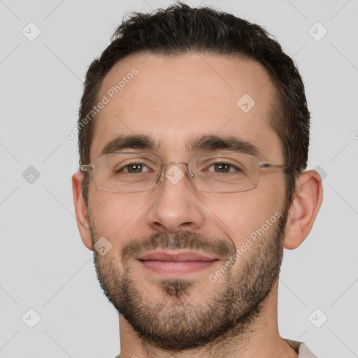 Joyful white adult male with short  brown hair and brown eyes