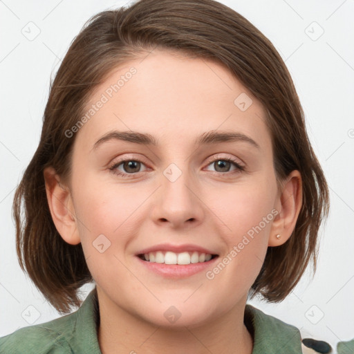 Joyful white young-adult female with medium  brown hair and green eyes