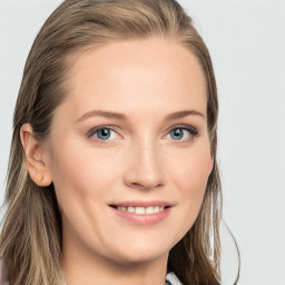 Joyful white young-adult female with long  brown hair and blue eyes