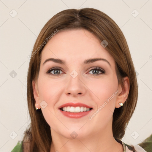 Joyful white young-adult female with long  brown hair and green eyes