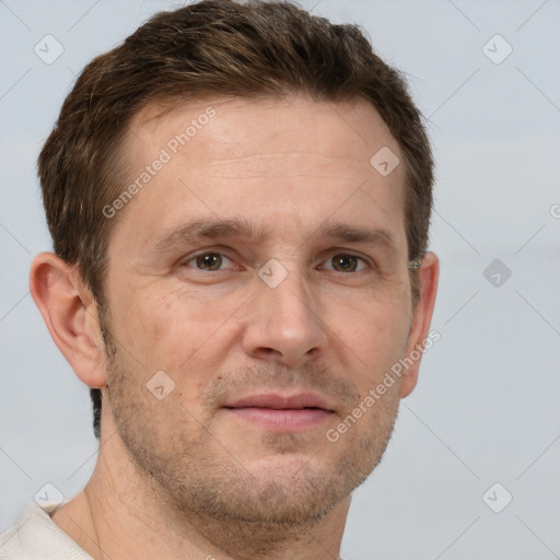 Joyful white adult male with short  brown hair and grey eyes