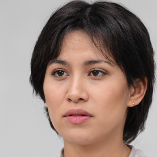 Neutral asian young-adult female with medium  brown hair and brown eyes