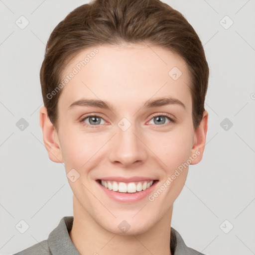 Joyful white young-adult female with short  brown hair and grey eyes