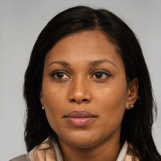Joyful black young-adult female with medium  black hair and brown eyes