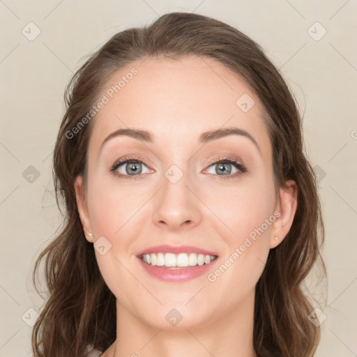 Joyful white young-adult female with long  brown hair and green eyes