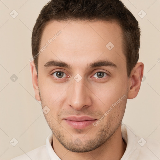 Joyful white young-adult male with short  brown hair and brown eyes