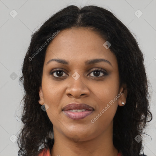 Joyful black young-adult female with long  brown hair and brown eyes