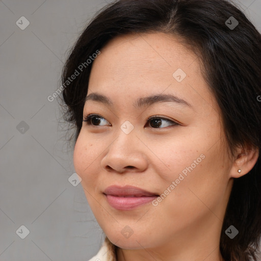 Joyful asian young-adult female with medium  brown hair and brown eyes