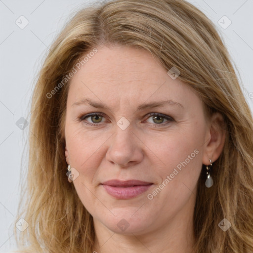 Joyful white adult female with long  brown hair and green eyes