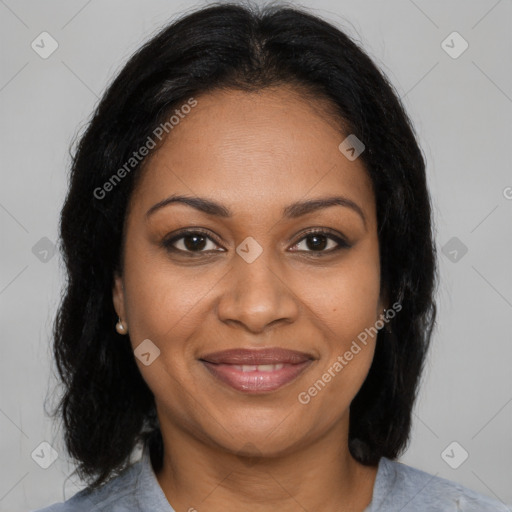 Joyful black adult female with medium  brown hair and brown eyes